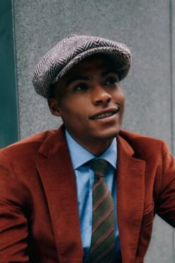 Muirfield Herringbone Bakerboy Cap 17 Muirfield Herringbone Bakerboy Cap -Lock & Co Hatters Sales MUIRFIELD HERRINGBONE BAKERBOY CAP LIFESTYLE SHOT 2